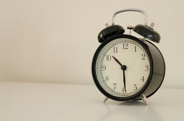 Alarm clock watch on vintage background — Stock Photo, Image
