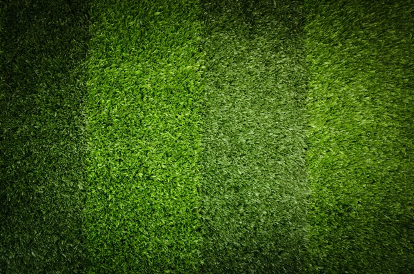 Grama verde artificial. Contexto do campo de futebol — Fotografia de Stock
