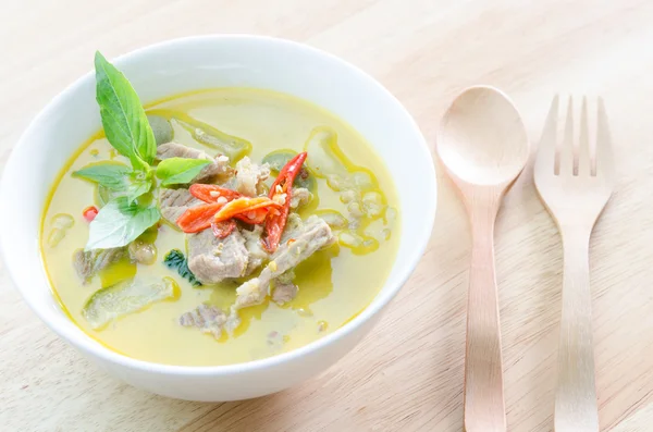 Green curry with pork   and woodden fork spoon — Stock Photo, Image