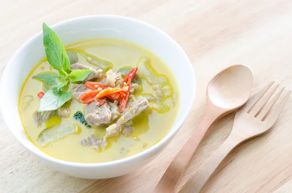 Green curry with pork   and woodden fork spoon — Stock Photo, Image