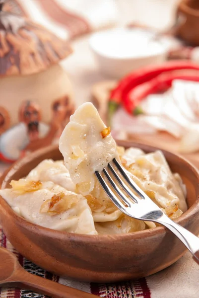 Ukrainian dumplings with stewed cabbage — Stock Photo, Image