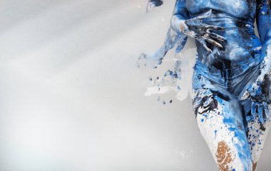 body of sexy, seductive, woman in underwear, artistically abstract painted with blue and white paint, standing at the background imprints of her body, copy space clipart