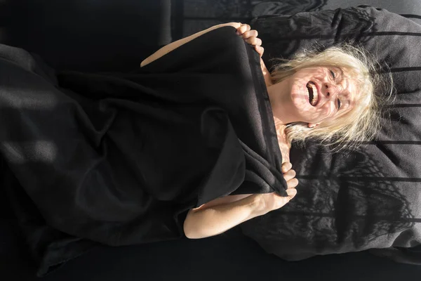 Top View Happy Laughing Blonde Sexy Woman Covering Herself Black — Stockfoto