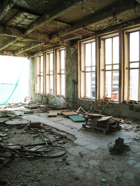 Abandoned building RTI-Rubber. Garbage and dirt in the premises of an abandoned building.