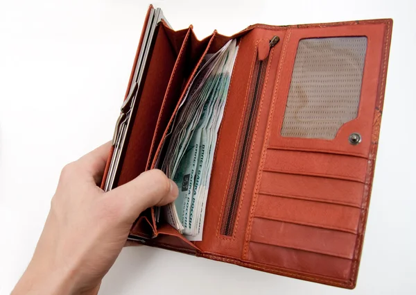 Pomarańczowy portfel z pieniędzmi — Zdjęcie stockowe