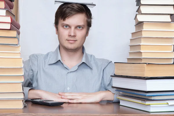 Man between books — Stock Photo, Image