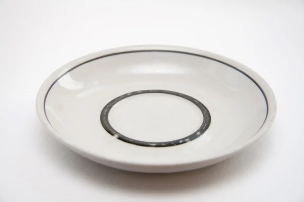 Plate on a light background — Stock Photo, Image