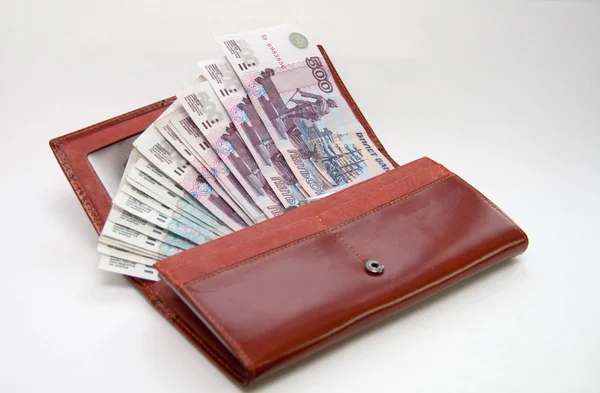 Orange leather wallet full of one hundred roubles — Stock Photo, Image