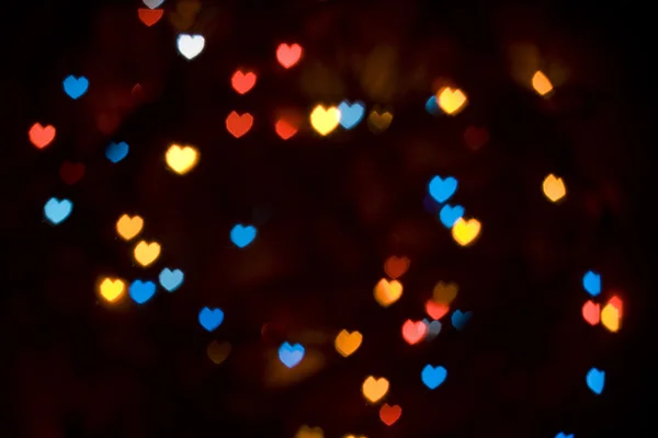 Färgglada bokeh hjärtformade ljus — Stockfoto