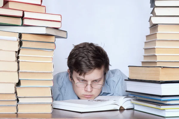 Man between books — Stock Photo, Image