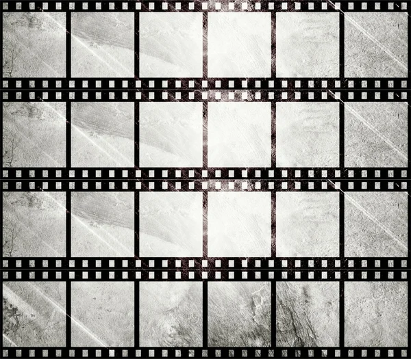 Aged film strip in grunge style — Stock Photo, Image