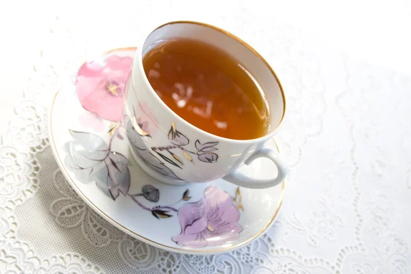 Cup of tea and white lump sugar Stock Picture
