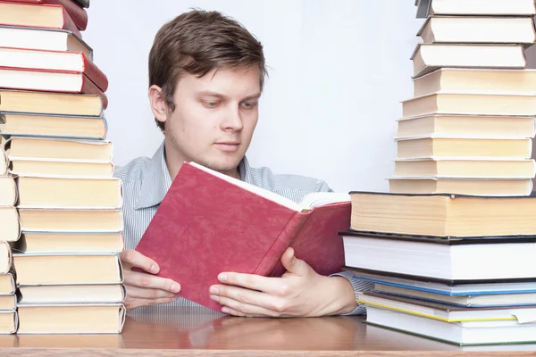 Man between books Stock Image