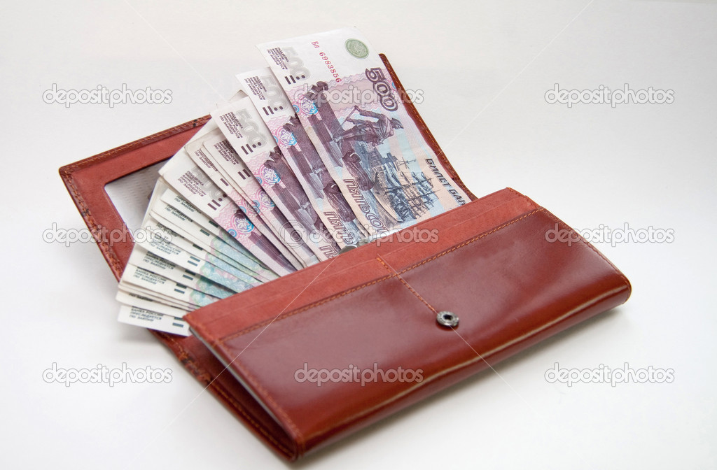 orange leather wallet full of one hundred roubles