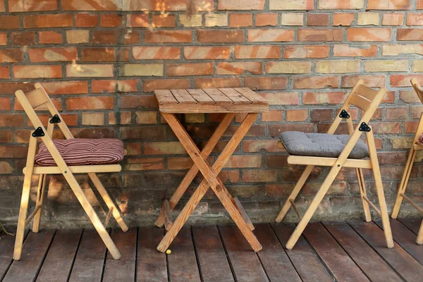 Empty Street Coffee Shop Wooden Terrace Brick Wall Wooden Chairs — Stock Photo, Image