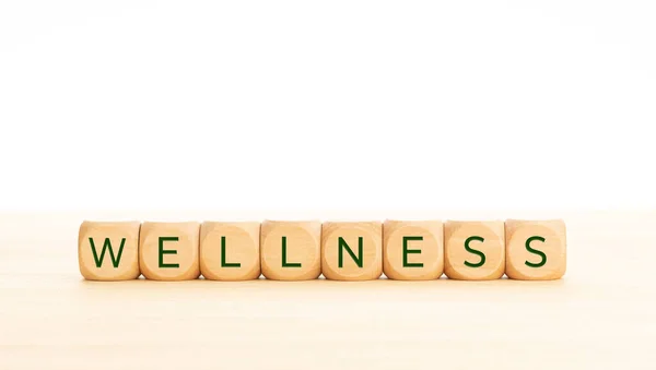 Wellness Word Wooden Blocks Table White Background Copy Space — Stock Photo, Image
