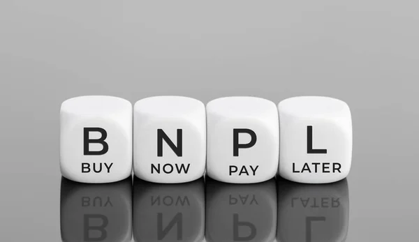 BNPL text on white blocks shape. Buy now pay later concept. Copy space