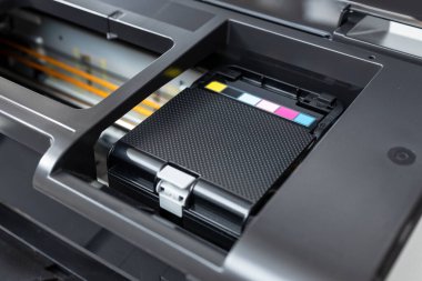 Close up of a multicolor ink cartridges container of a inkjet printer