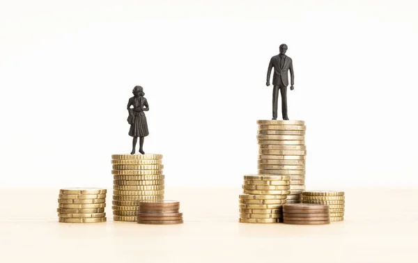Gender Wage Gap Concept Man Woman Figurines Standing Top Pile — Stock Photo, Image