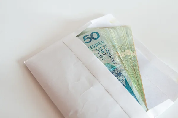 Polish money in an envelope as a bribe — Stock Photo, Image