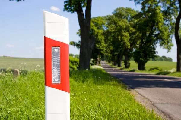 Road sign post on the road a distance — Stock Photo, Image