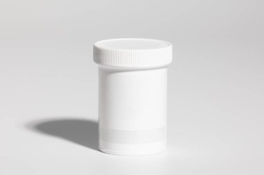 Mockup of isolated plastic medicine bottle, for pills, with screw cap and blank label for packaging design, on white background, real studio photo product, no 3D