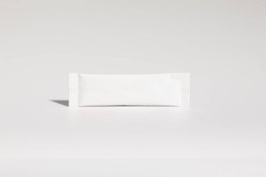 Mockup of isolated envelope of medicine, for powder, with blank label for packaging design, on white background, real photo studio, no 3D