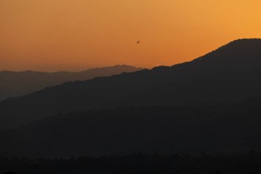 Landscape of the sunset mountains of Lore Lindu national park, near Bomba, South Lore, Poso Regency, Central Celebes, Indonesia