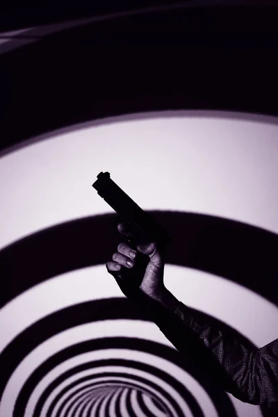 Spy thriller book cover design with man holding pistol gun.