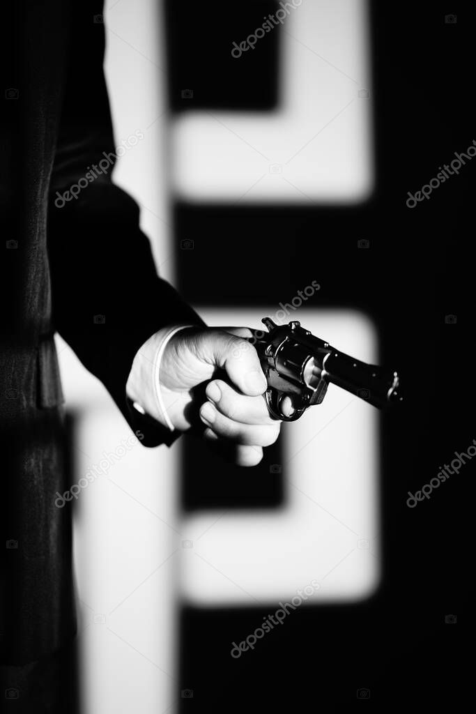 Detective male spy holding pistol gun crime thriller book cover design photo.