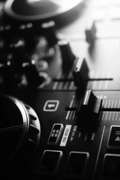 Deejay mixing desk black and white photo in Ibiza nightclub house music party.