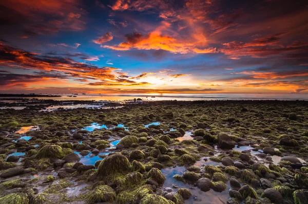 Batu Luang KUala Penyu sunset with green stone and fire sky — Stock Photo, Image