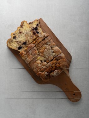 artisan baked cinnamon blueberry bread loaf and slice with spices and swirls