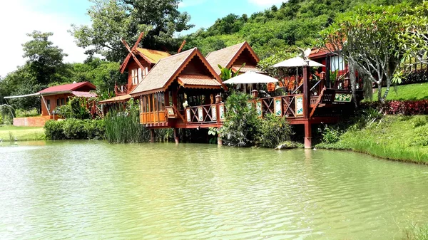 Thai style house on the water. — Stock Photo, Image