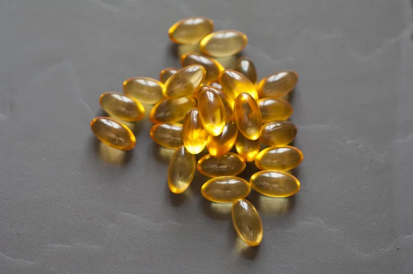 Närbild på e-vitamin kapslar Royaltyfria Stockbilder