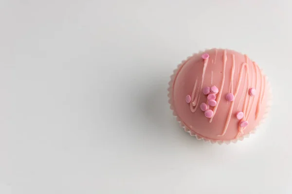Pink chocolate bomb sweets. on a bright white background. these sweets are becoming a big trend the upcoming days.