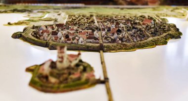 Vyborg, Russia - December 30, 2021, a small model with miniatures of the medieval city of Vyborg and the Vyborg castle