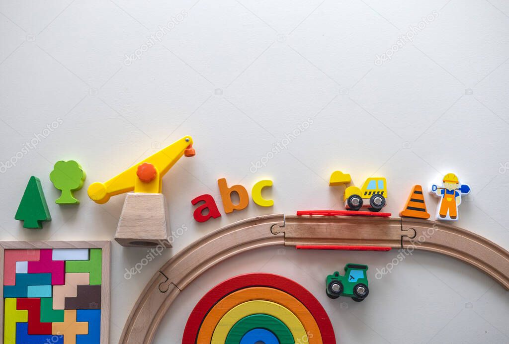 Variety of brightly colored children toys. Flat lay. Copy space. Montessori education concept.