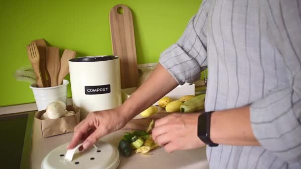 Adult Woman Stands Kitchen Cleaning Zucchini Vegetable Peeler Composting Waste — Video