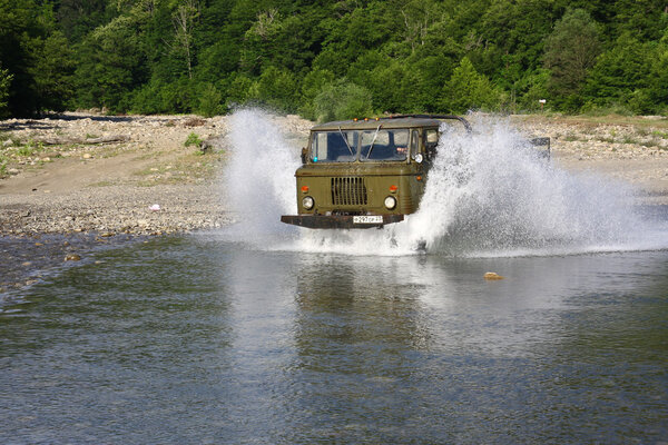 Car speeding along a river