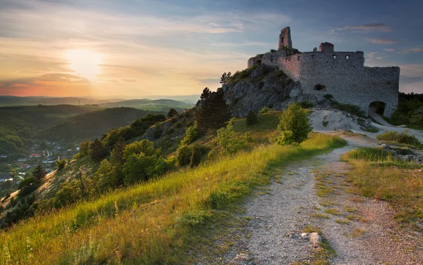 Ruin of castle with sun — Stock Photo, Image
