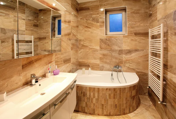 Bathroom in luxury home with bath and furniture — Stock Photo, Image