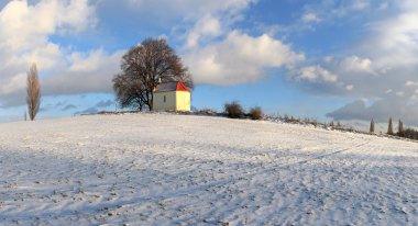 Beautiful winter landscape with chapel clipart