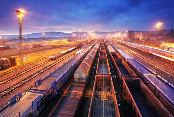 Cargo train platform at night - Freight trasportation