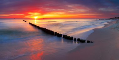 Baltic sea at beautiful sunrise in Poland beach. clipart