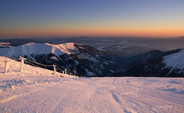Ski slope in sunset — Stock Photo, Image