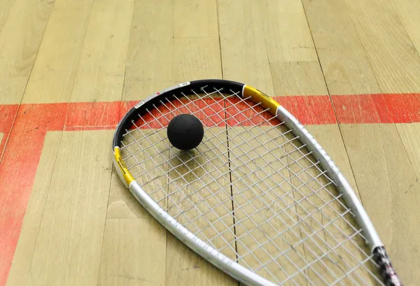 Squash court and racket with ball