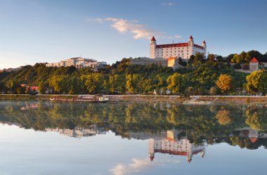 Bratislava castle with reflection in river Danube clipart
