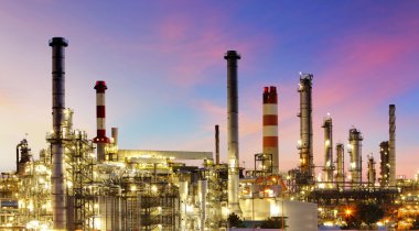 Oil refinery at twilight - factory clipart