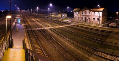 Historic train station, at night clipart